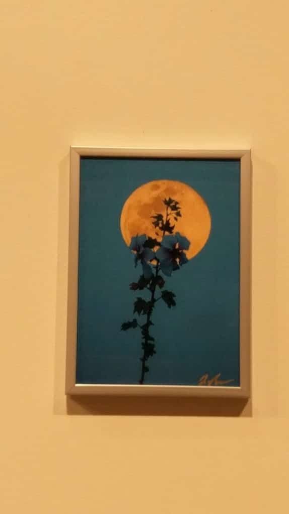 a painting hanging on a wall